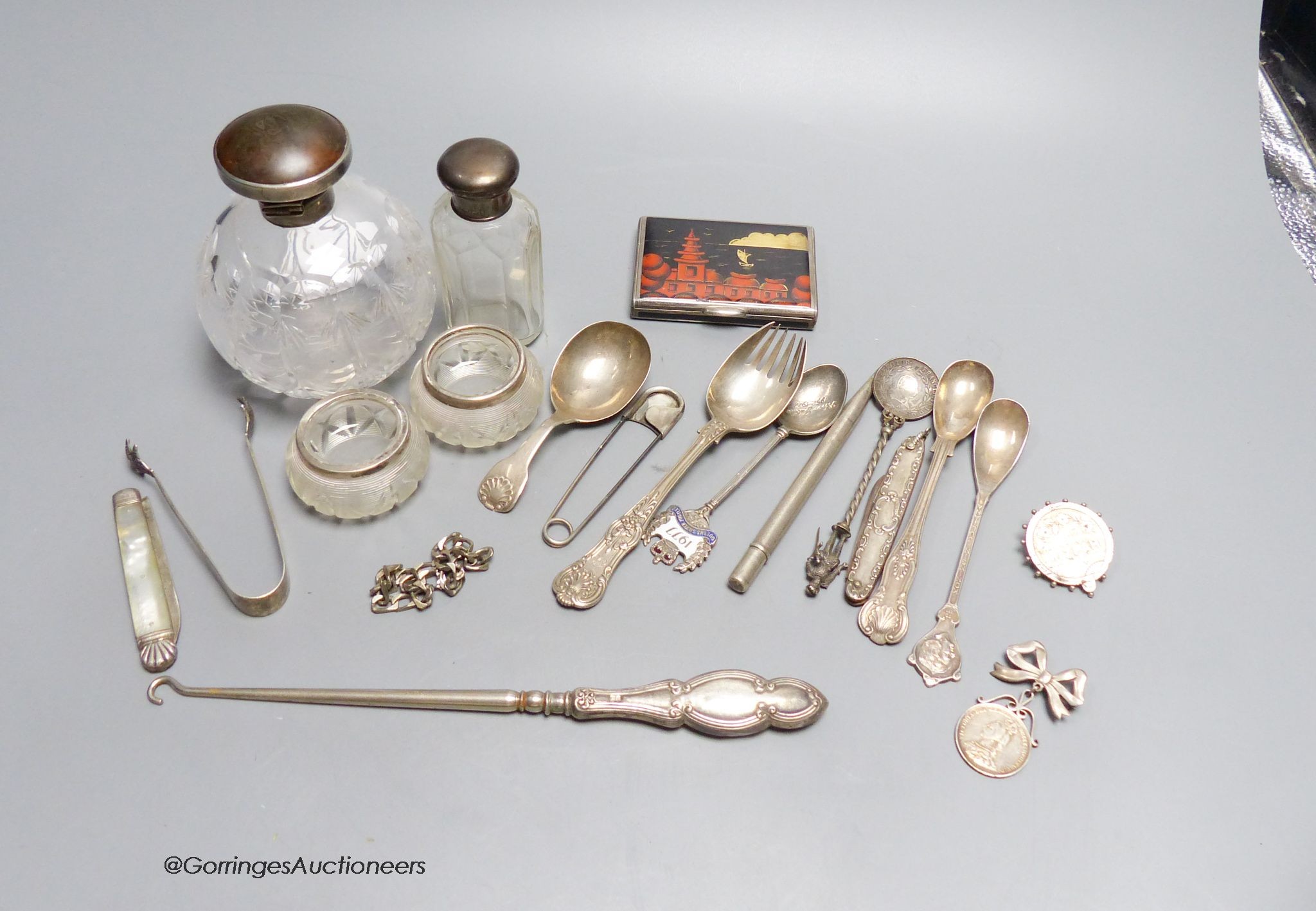 Two silver-mounted toilet bottles, a pair of silver-mounted salts, an enamelled silver box (a.f.), a caddy spoon, etc.